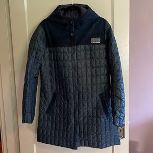 Gently used Patagonia mid-length puffer coat with hood and plaid trim. Size L.